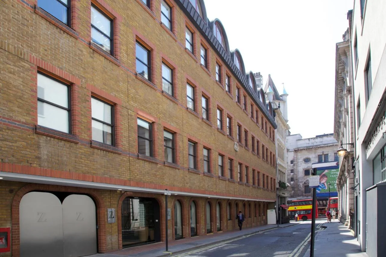 a large brick building on a city street at The Z Hotel Piccadilly in London