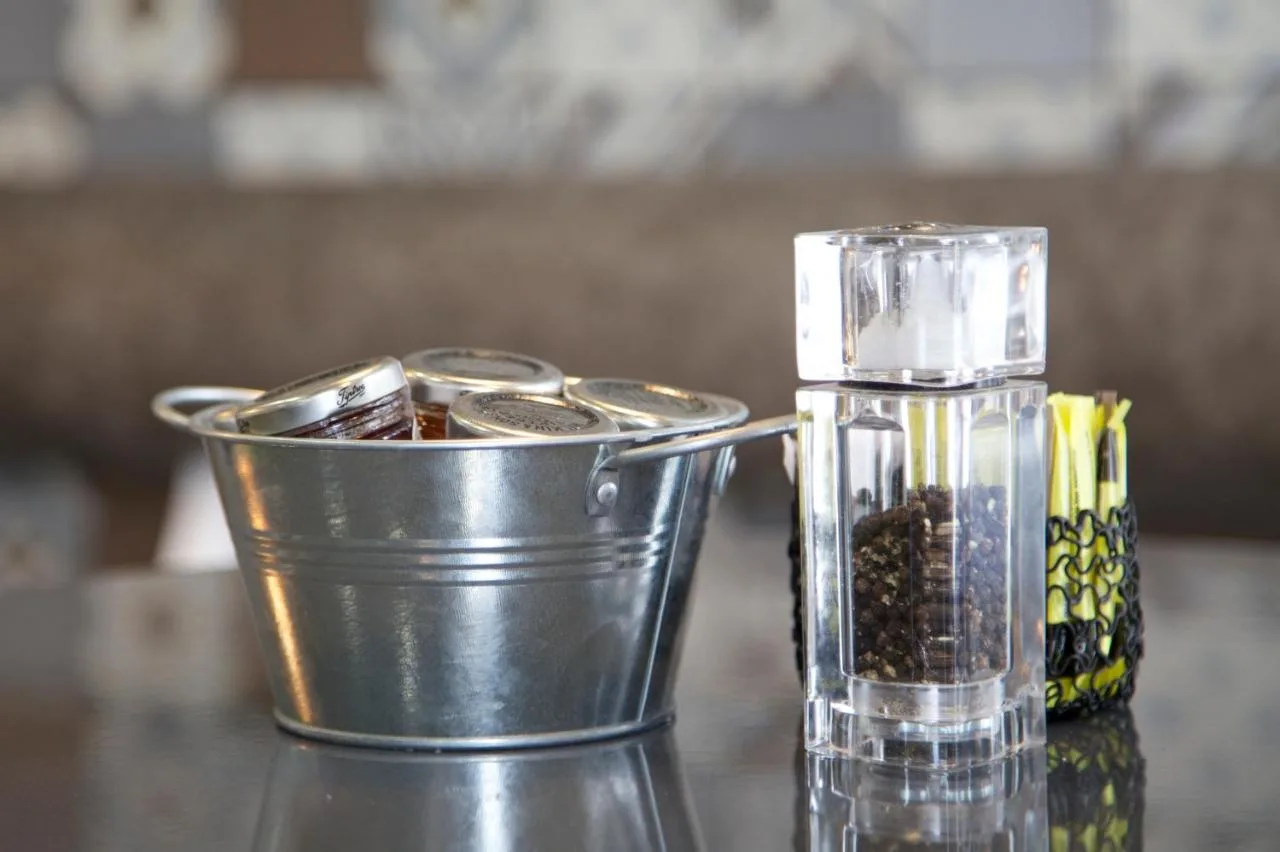 a blender sitting on a table with a container of spices at The Z Hotel Piccadilly in London